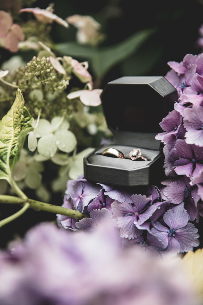wedding rings on purple flowers by Kiriell Visuals