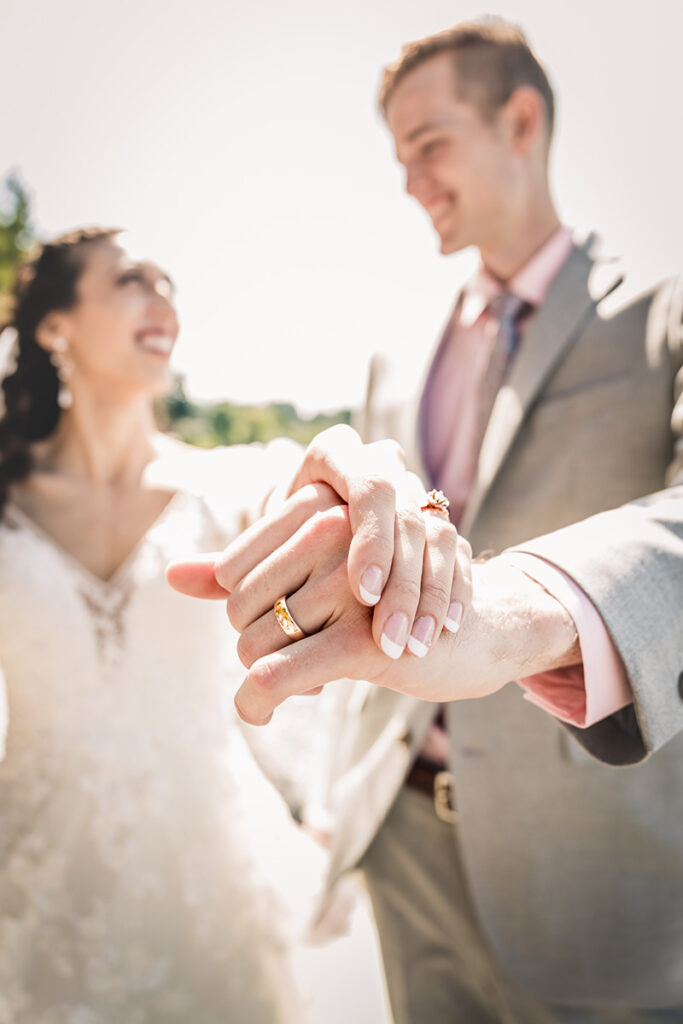 bride and groom holding hands by Kiriell Visuals