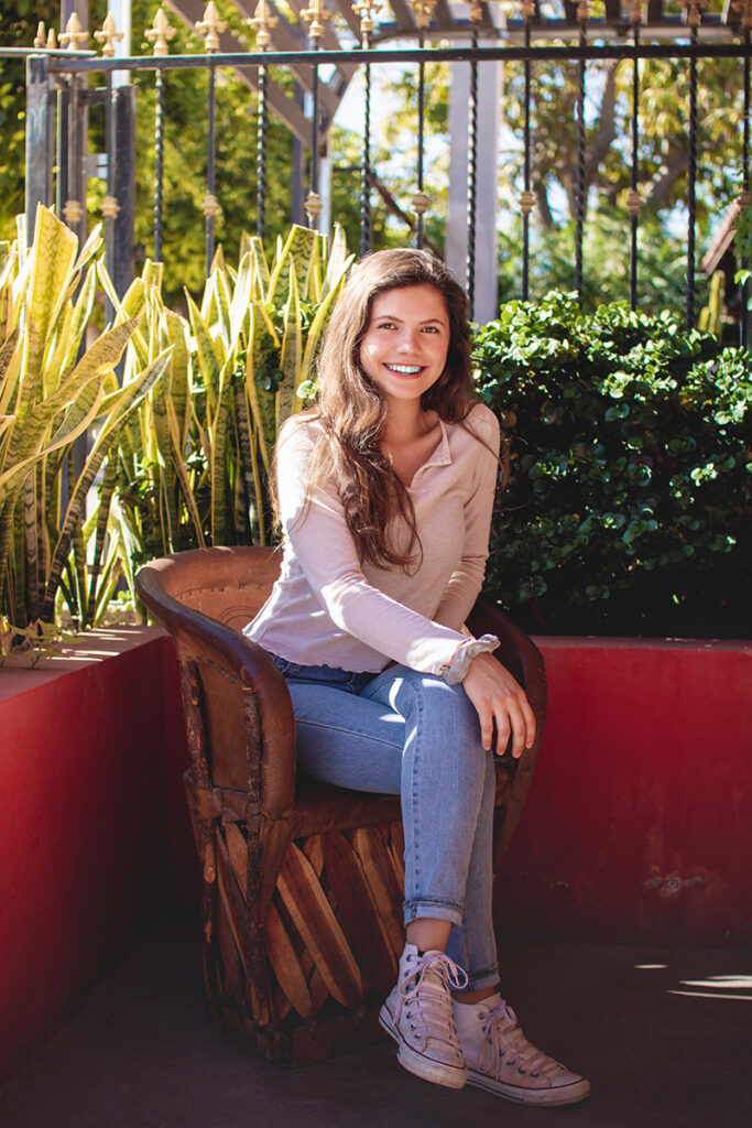Girl sitting by plants portrait by Kiriell Visuals
