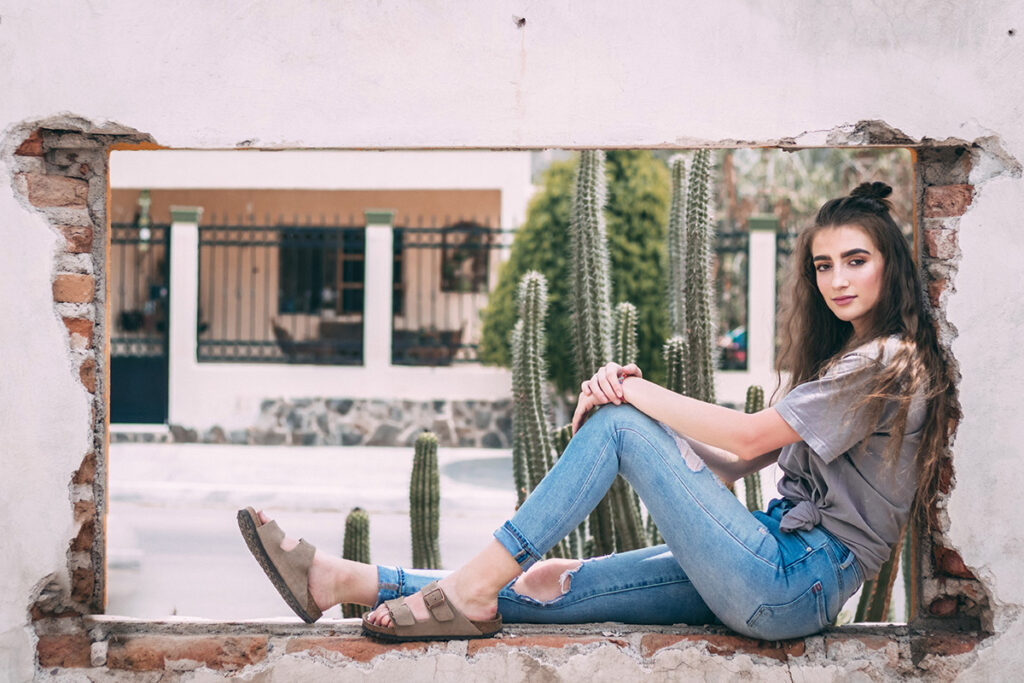 girl sitting in window portrait by Kiriell Visuals